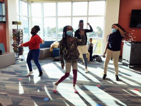 Culutural Expressions members Oziyana Morton, Za-riyah Herring, Jamia Sutton and Zachyliah Herring practice a dance routine in the media center. 