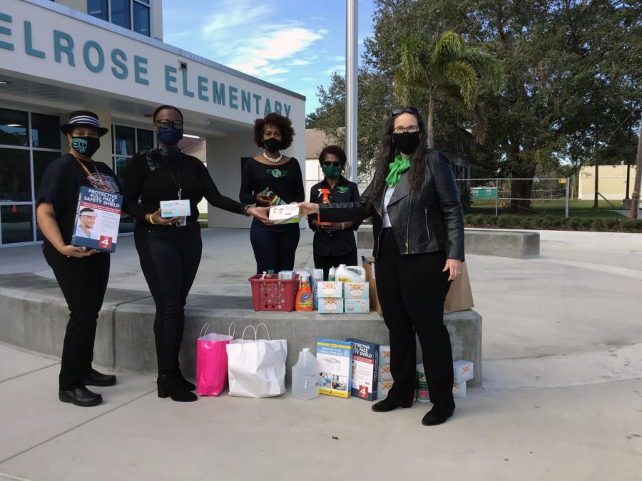 Melrose staff accept COVID supplies from the St. Petersburg chapter of the Links. The Links donated face masks, hand sanitizer, cleaners, face shields and more.